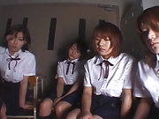 Four Japanese school girls spitting on teacher