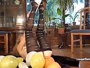Mature model Doris Dawn plays with balloons and her hairy...