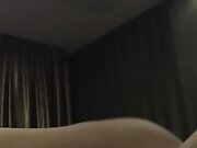 A young Chinese woman and her boyfriend watch