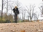 Blonde german lady in spandex uniform goes for a walk