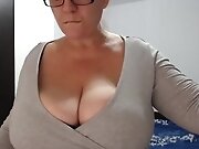 Busty cougar is teasing men with her huge boobs