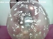 Girl inflates 16 inch clear balloon
